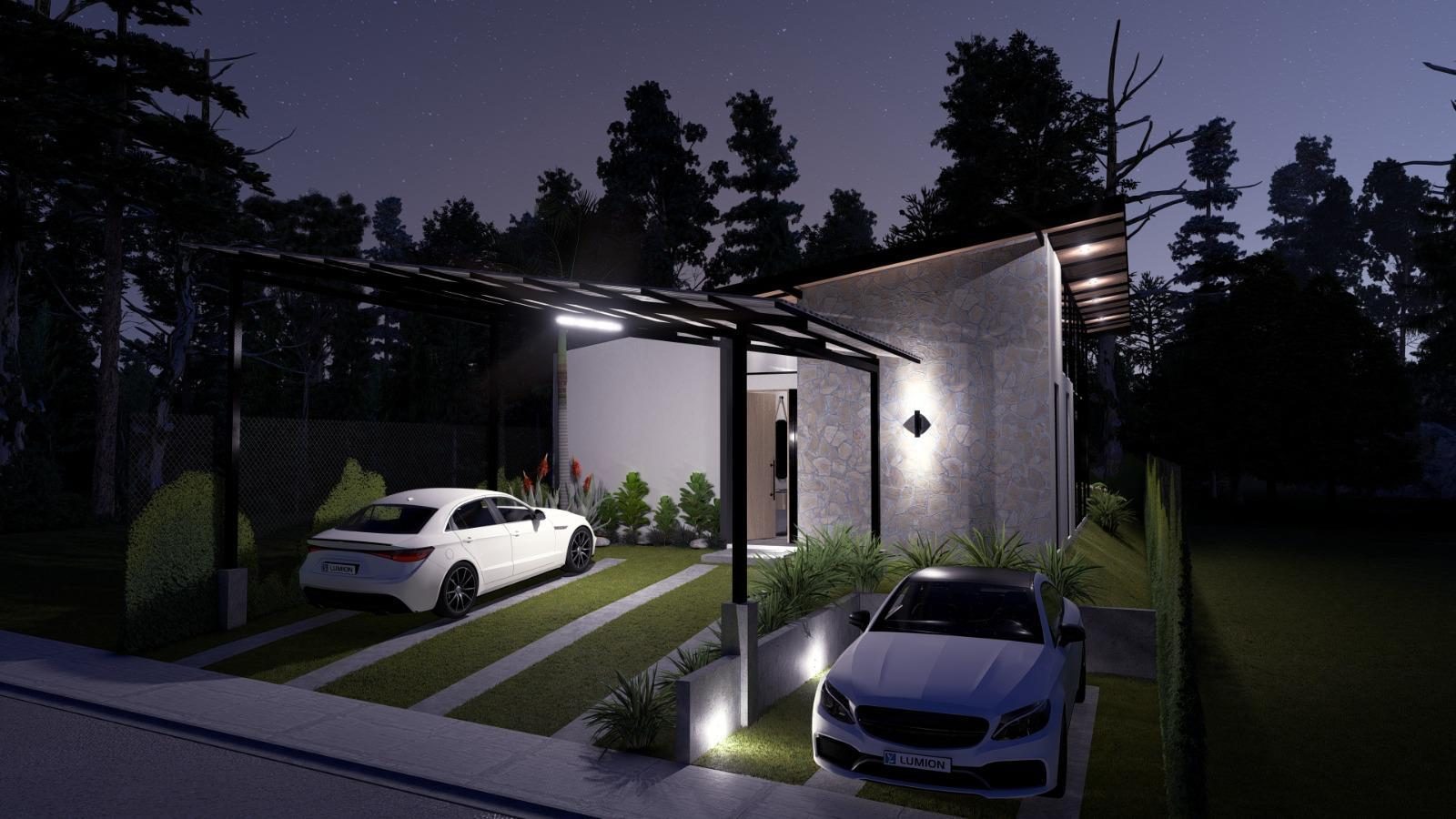 Fachada frontal de Residencia Aura iluminada de noche
