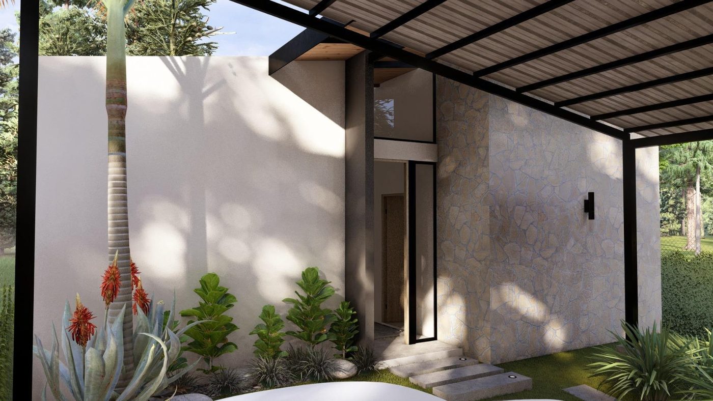Entrada principal de Residencia Aura bajo la pérgola, con muro de piedra